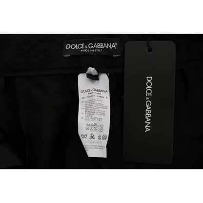Dolce & Gabbana sort etiketter på sorte brokade capri shorts