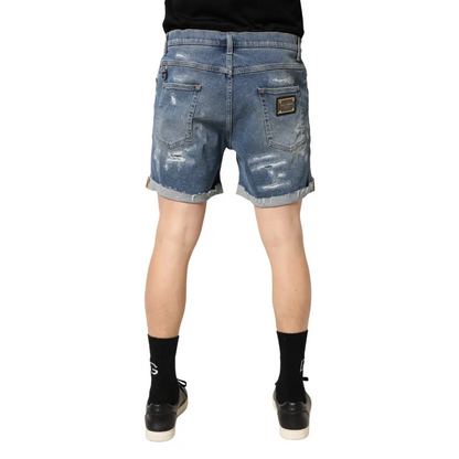 Distressed Dolce & Gabbana blue cotton Bermuda shorts med rullede manchetter og guld-tone mærkeplet