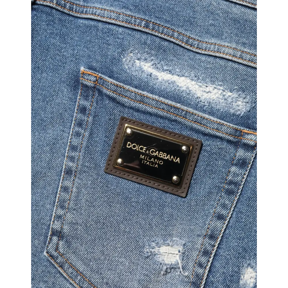 Dolce & Gabbana logo patch on blue cotton distressed bermuda shorts