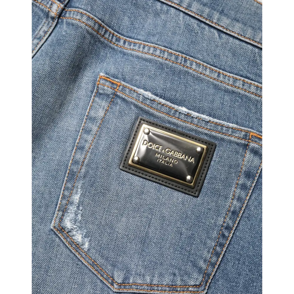 Dolce & Gabbana blue tattered slim fit jeans med sort læderpatch og guldtekst