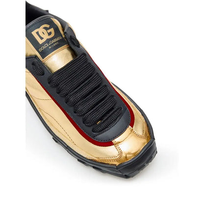 Dolce & Gabbana gold leather low top sneaker med rød syning