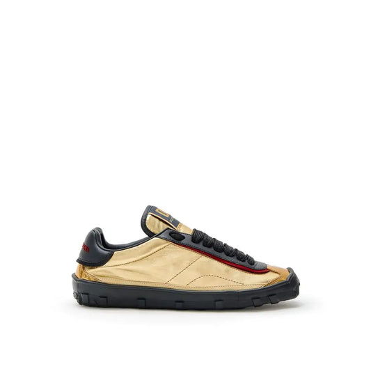 Dolce & Gabbana gold leather low top sneakers with black accents and red stitching