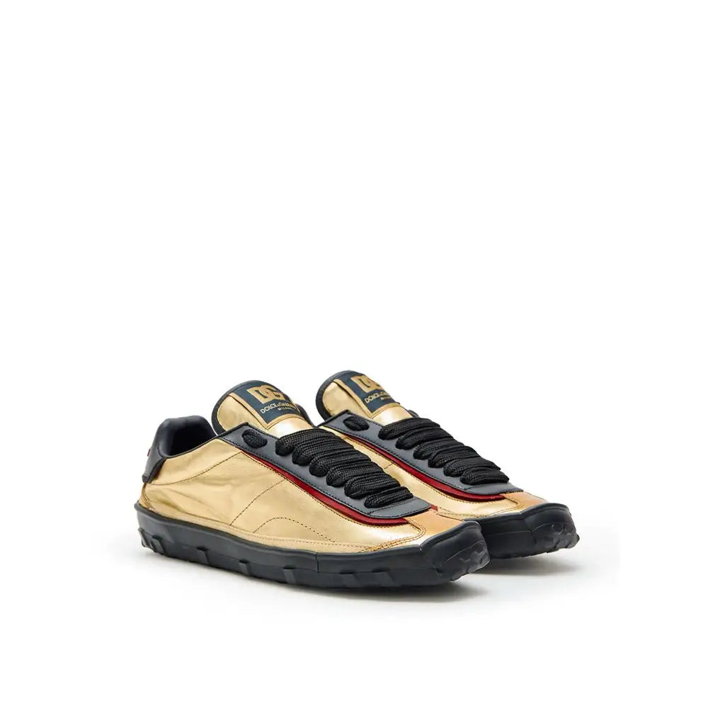 Dolce & Gabbana gold leather low top sneakers med røde syninger
