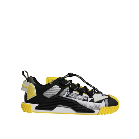 Dolce & Gabbana multicolor low top NS1 sneakers in black and yellow with textured mesh upper, carbon fiber-like panels, and bold rubber soles