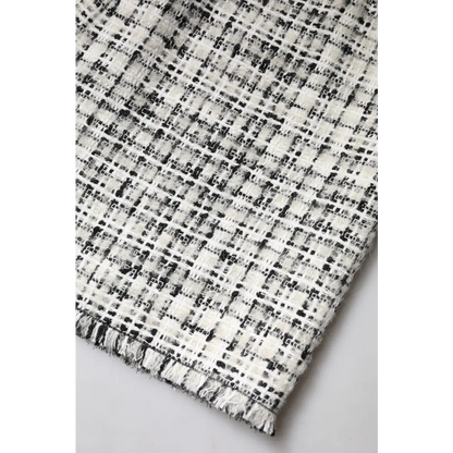 Dolce & Gabbana white black high waist tartan tweed mini skirt in black and white fabric with textured woven pattern and frayed edges