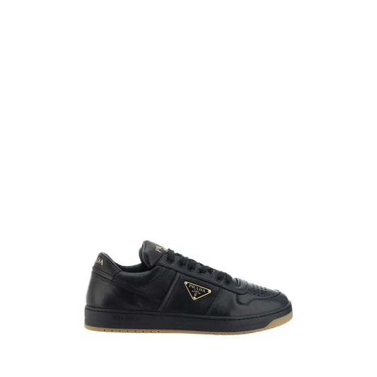 Prada black calf leather Bos Taurus low-top sneakers with gold logo and gum sole