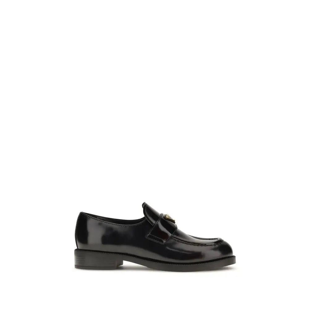 Prada black calf leather Bos Taurus slip-on loafers with patent finish and gold logo