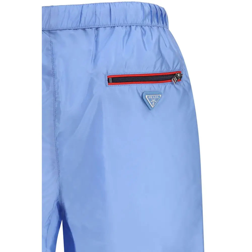 Prada blue recycled polyamide swim shorts med rødtrimmet lynlås og trekantet logo