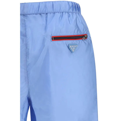 Prada blue recycled polyamide swim shorts med rødtrimmet lynlås og trekantet logo
