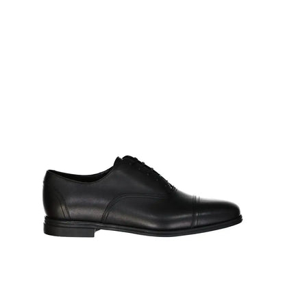 Salvatore Ferragamo sorte læder oxfords med cap-toe og poleret finish