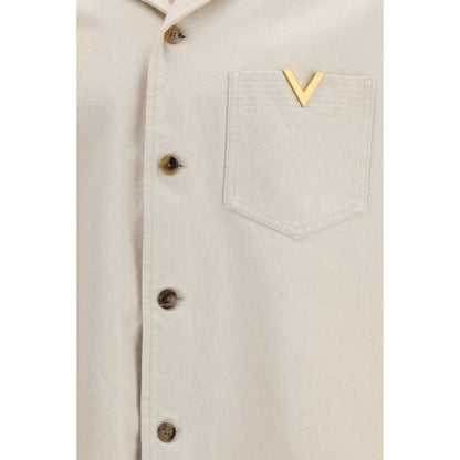 Valentino beige denim shirt with gold-tone V-shaped metal pin on pocket